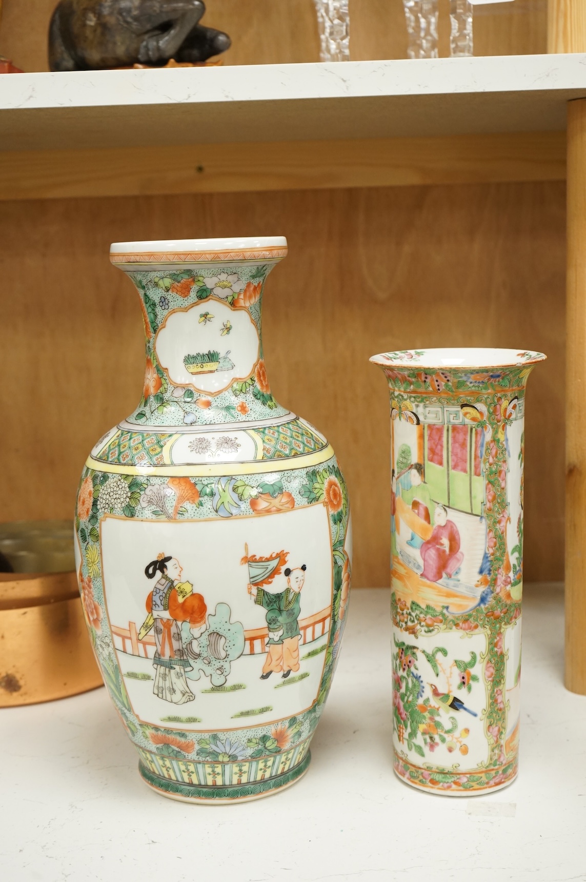 Two Chinese porcelain vases to include a famille rose sleeve vase and a larger famille verte vase, 36cm high